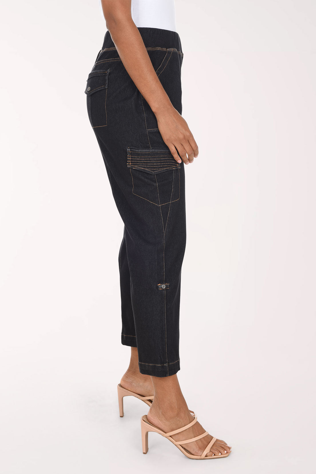 Woman wearing black denim cargo pants