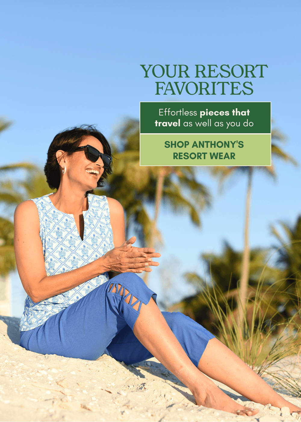 A woman sitting on a sandy beach wearing a light blue patterned sleeveless top and blue shorts, with palm trees and a blue sky in the background. Text on the right reads 'YOUR RESORT FAVORITES' and 'SHOP ANTHONY'S RESORT WEAR'.