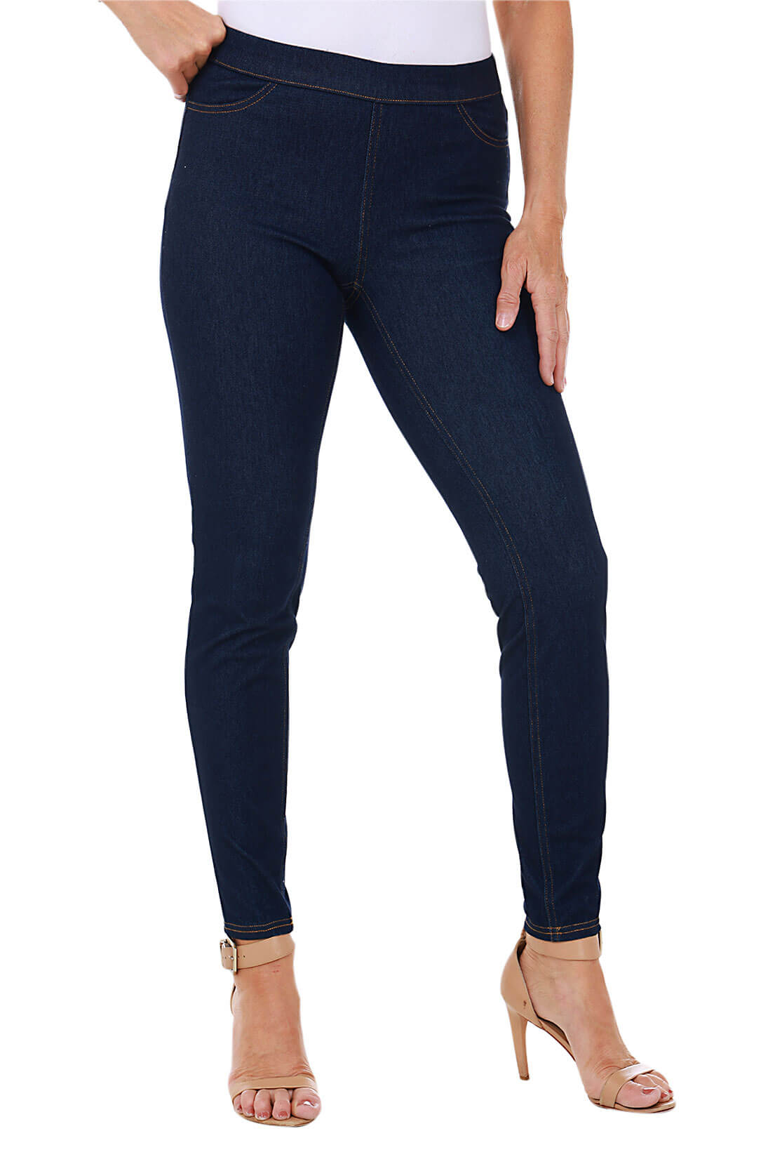 Dark blue jeans worn by a person on a white background