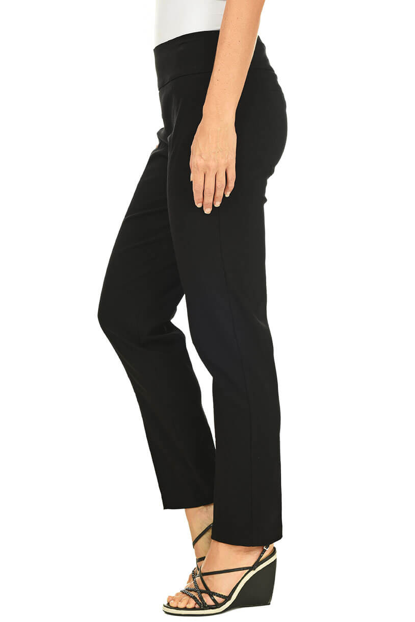 A side shot of a model wearing black pull-on full-length pants with a mesh panel in the waistband and a front leg seam for a tailored look.