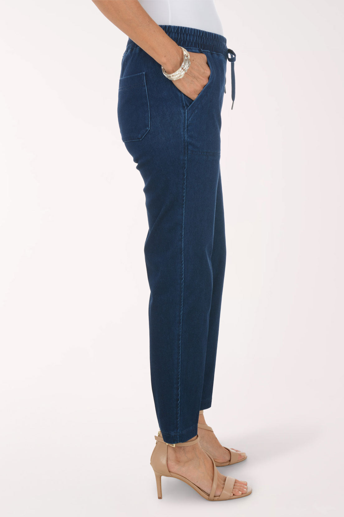 Side view of the Dark Wash Drawstring Relaxed Denim Pant showing the relaxed thigh and tapered ankle