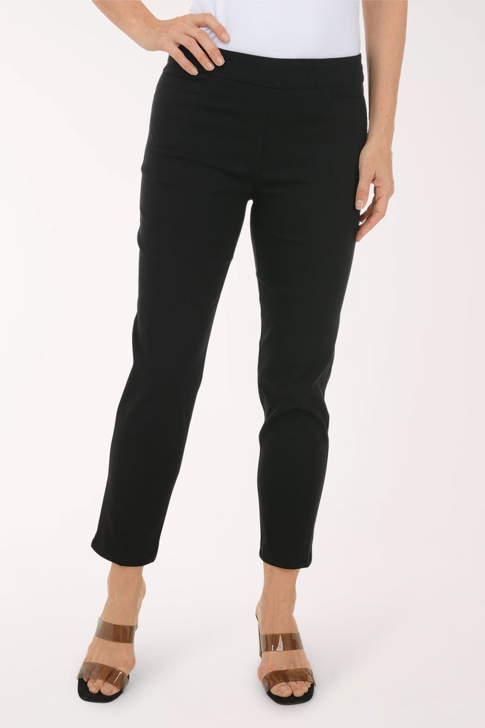 Person wearing black pants on a white background
