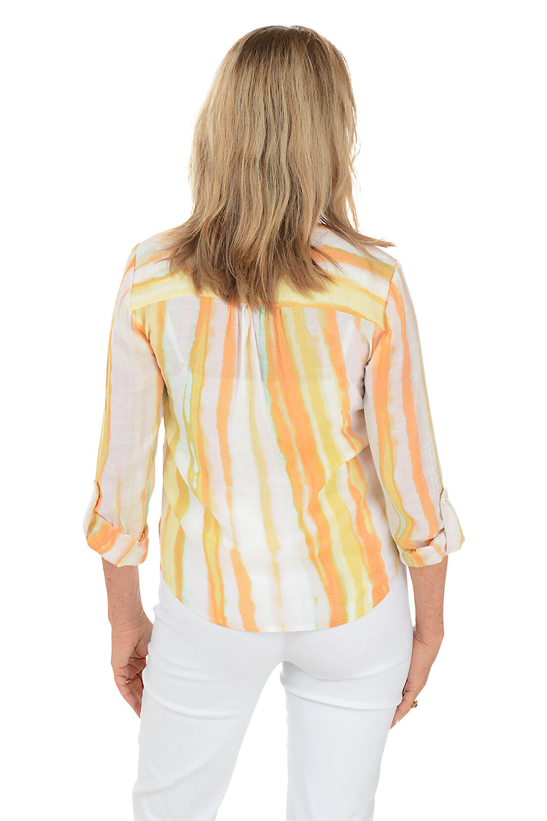 A back shot of a model wearing a striped button-front blouse with a mandarin collar and a left chest pocket, in shades of orange and white, paired with white pants.