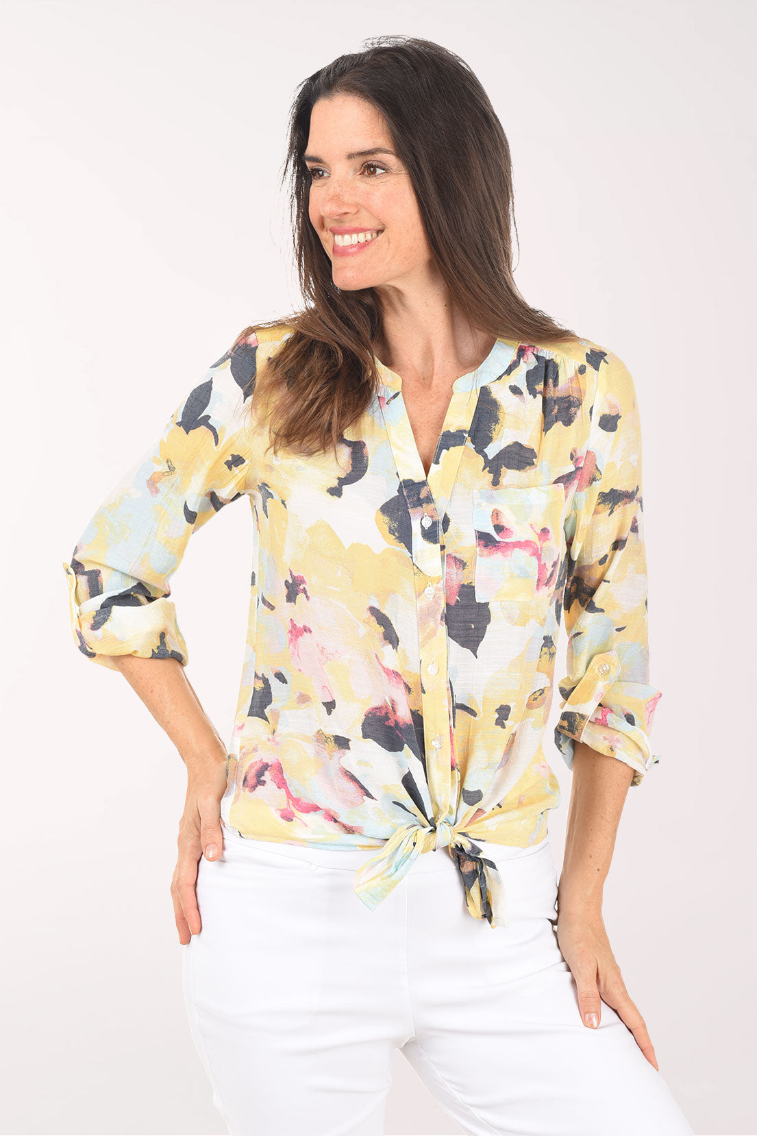 Woman wearing a floral blouse with a white background