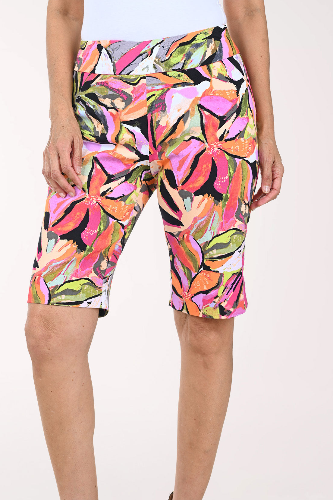 Colorful floral-patterned shorts worn by a person on a white background