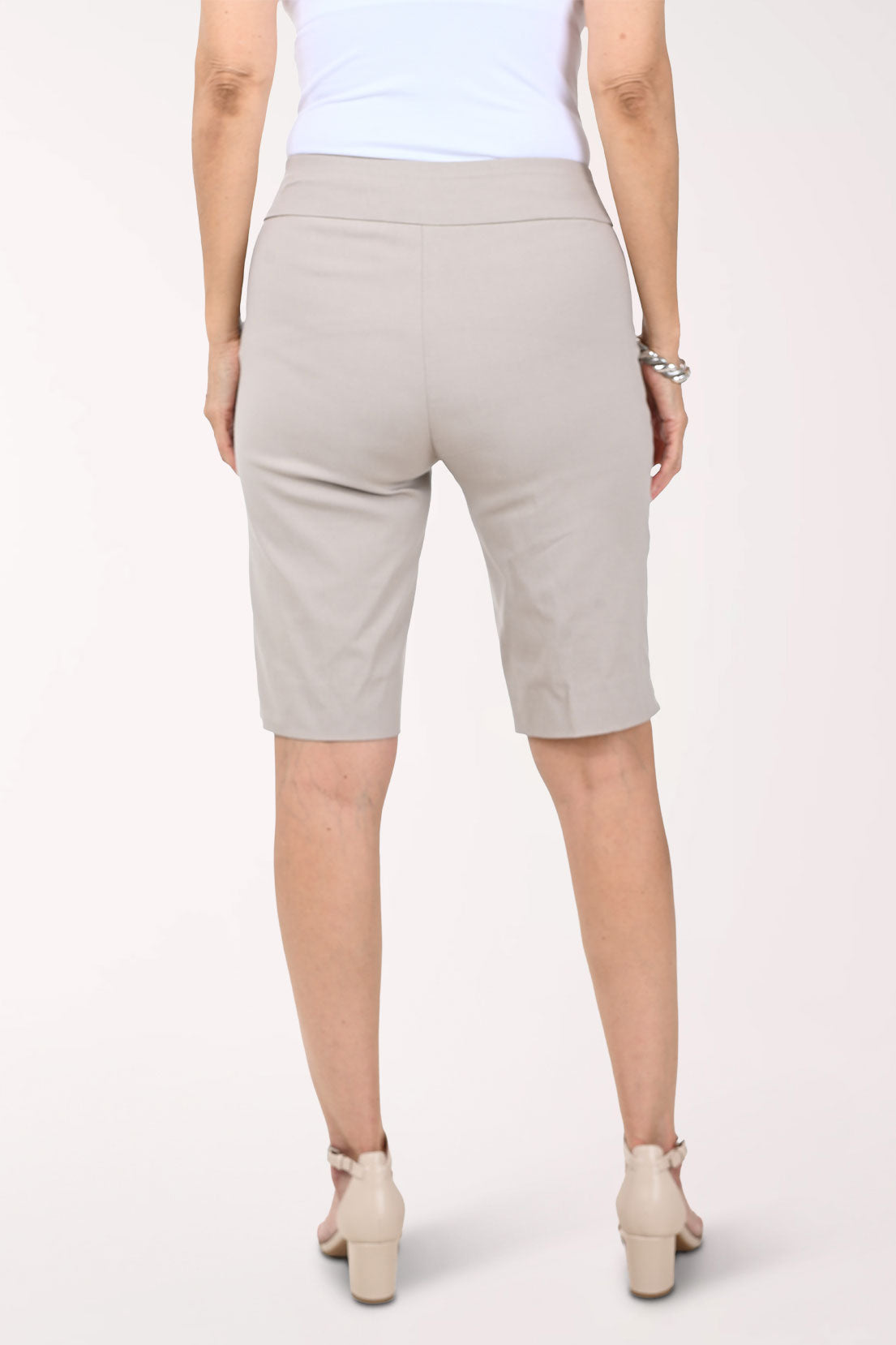 Woman wearing solid beige bermuda shorts