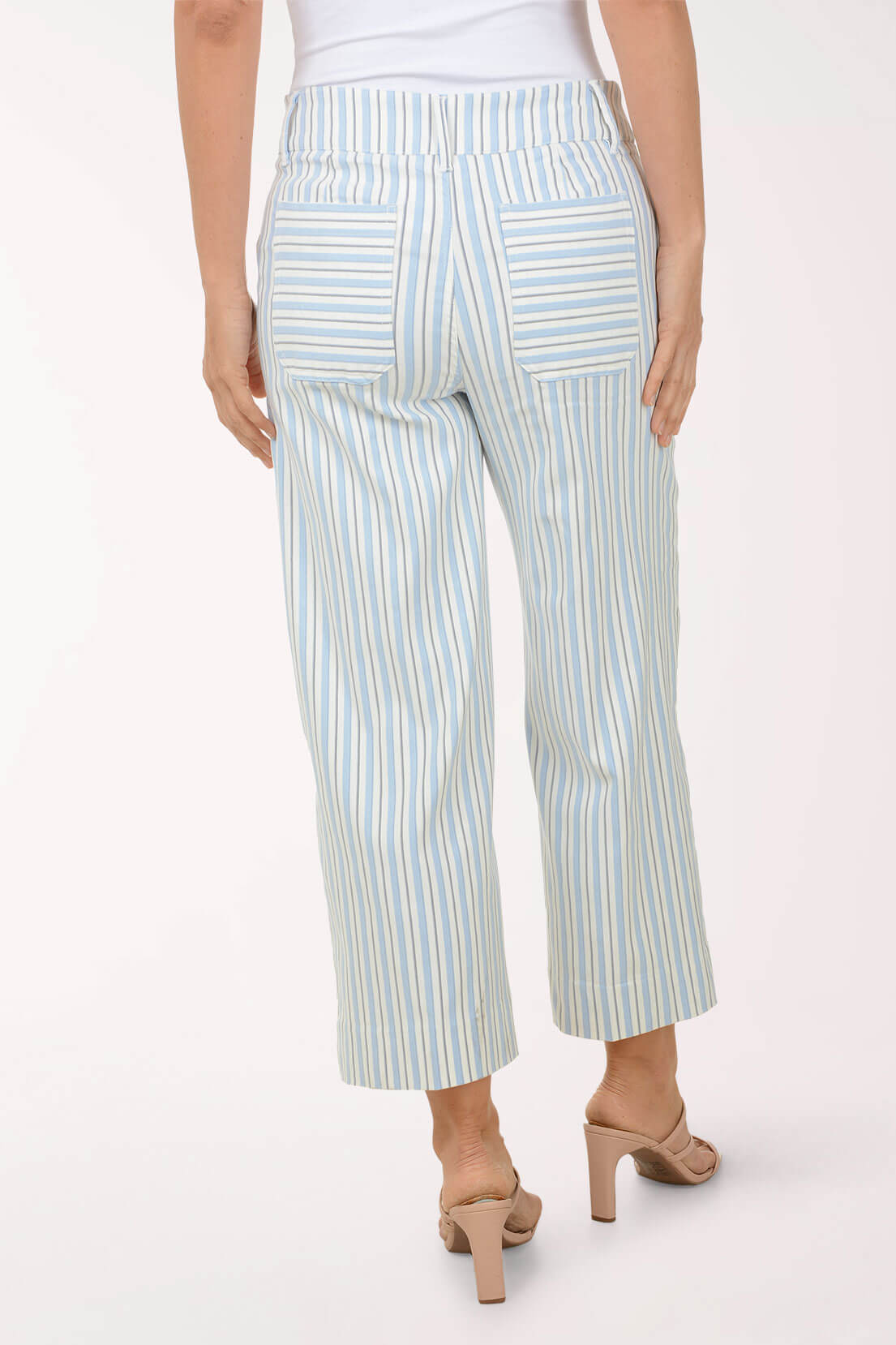 Light blue and white striped pants worn by a person on a white background