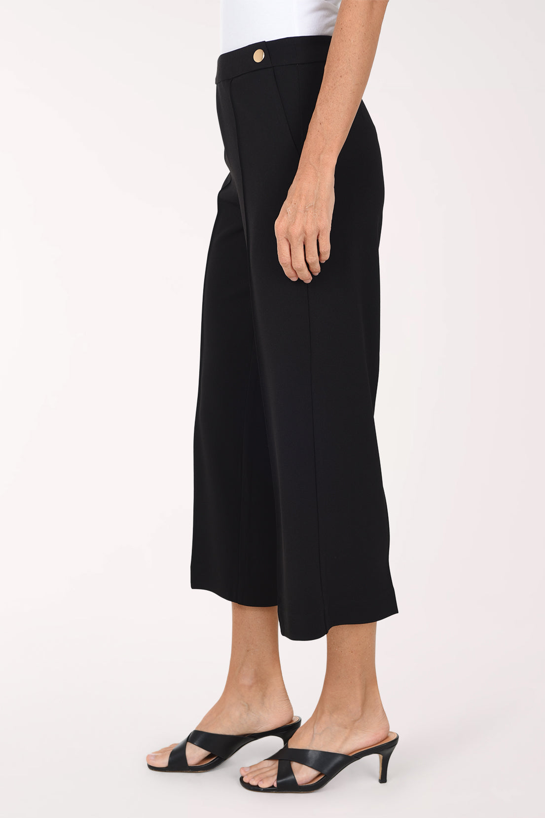 Woman wearing black crop pants