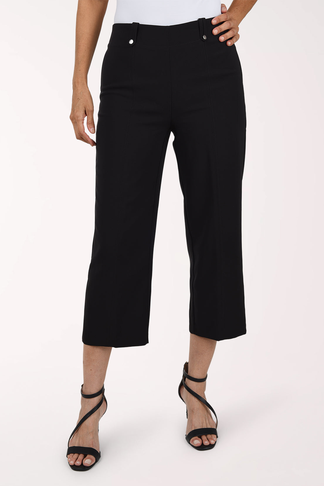 Woman wearing black pull on capri pants