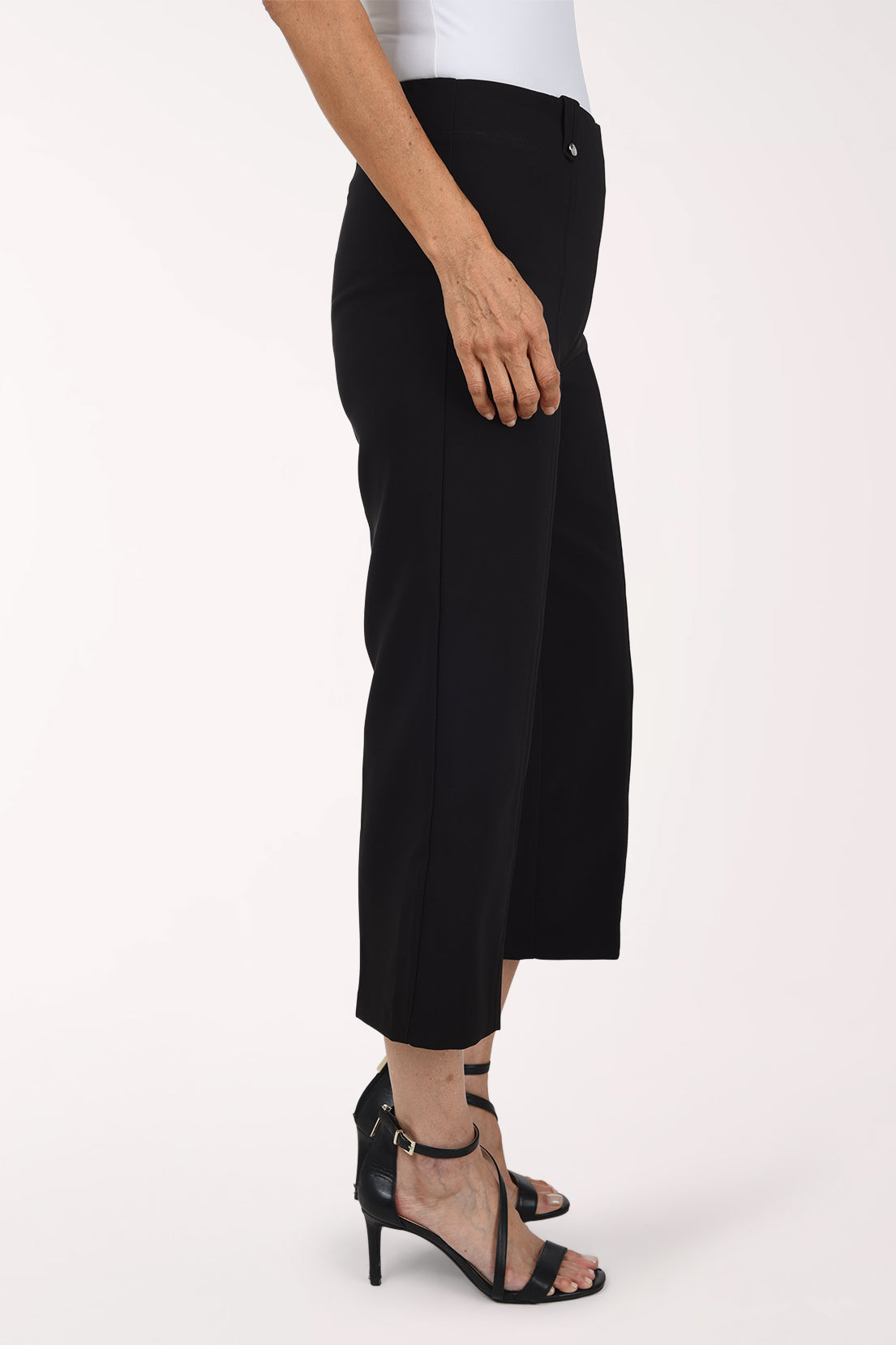 Woman wearing black pull on capri pants