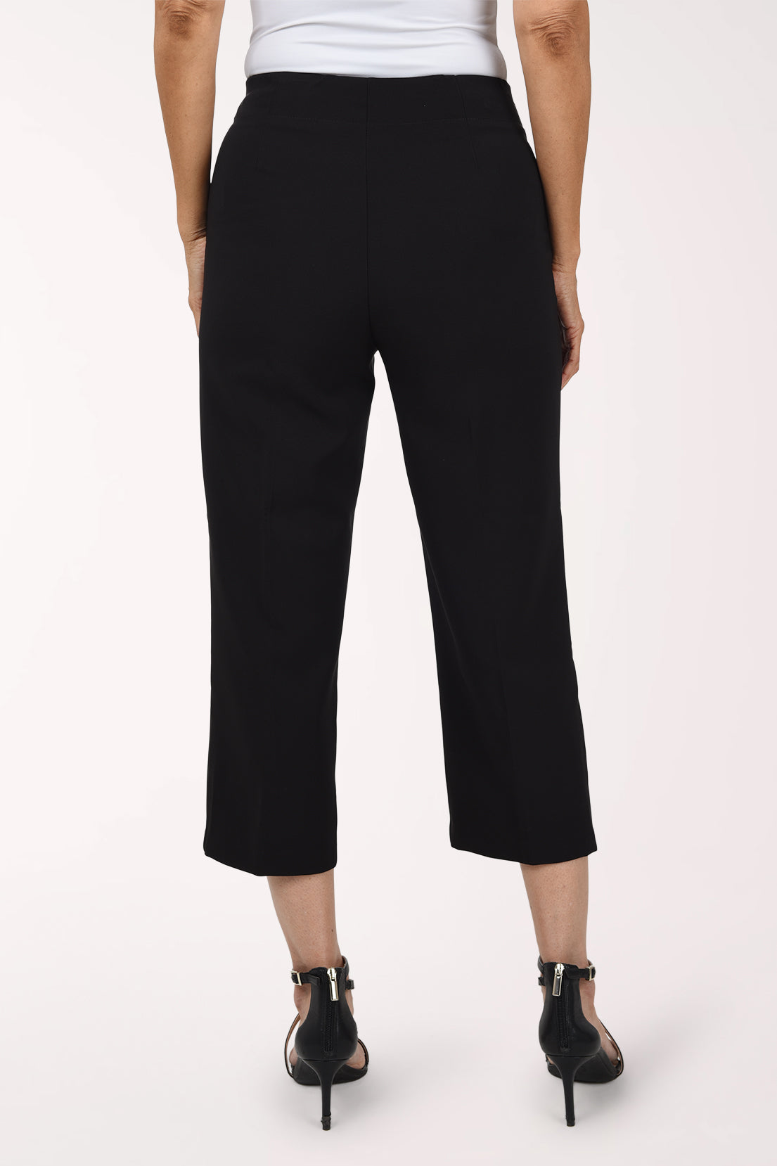 Woman wearing black pull on capri pants