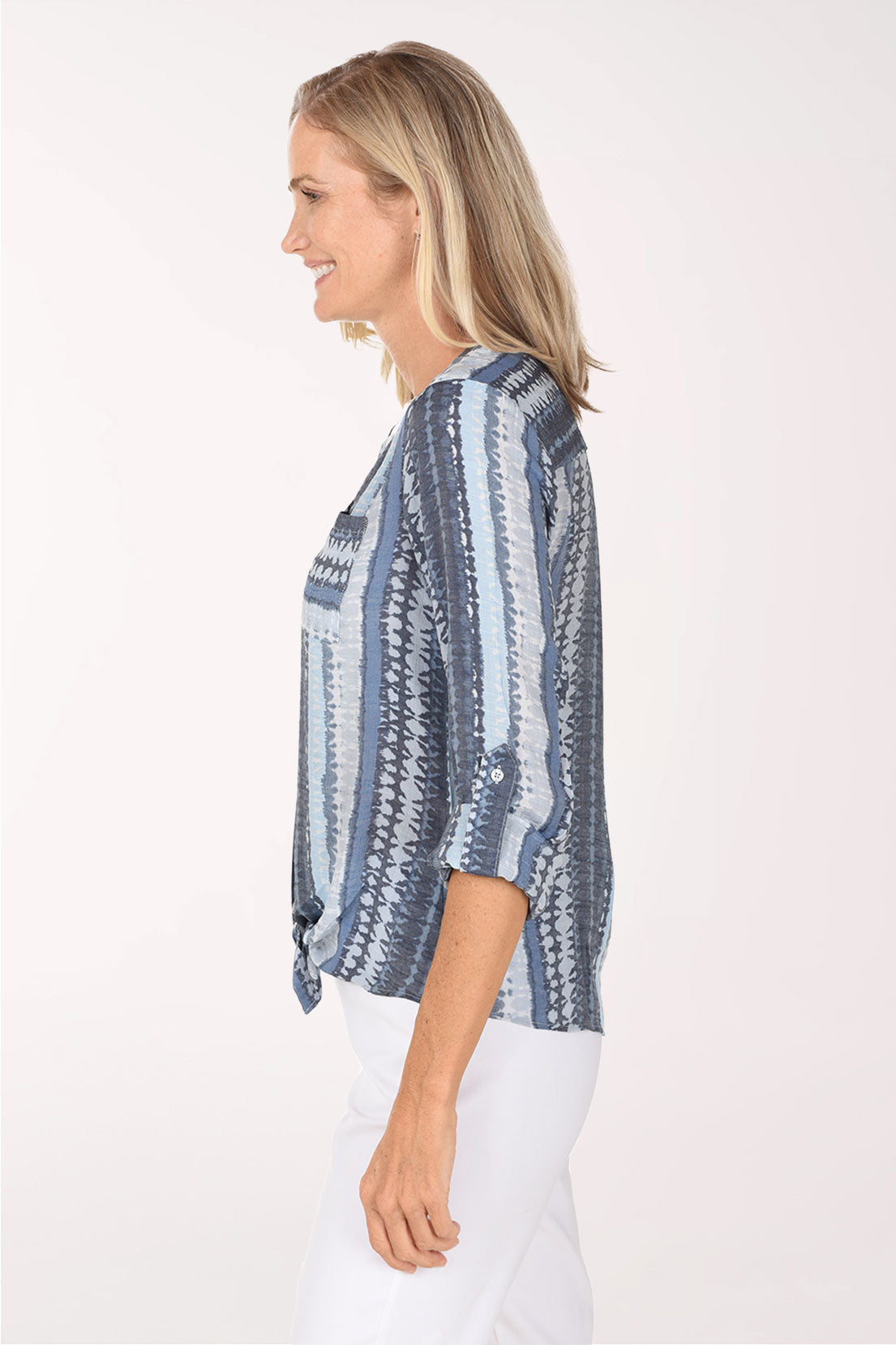 Side view of the Mottled Blue Striped Button-Front Blouse with the tied high-low hem