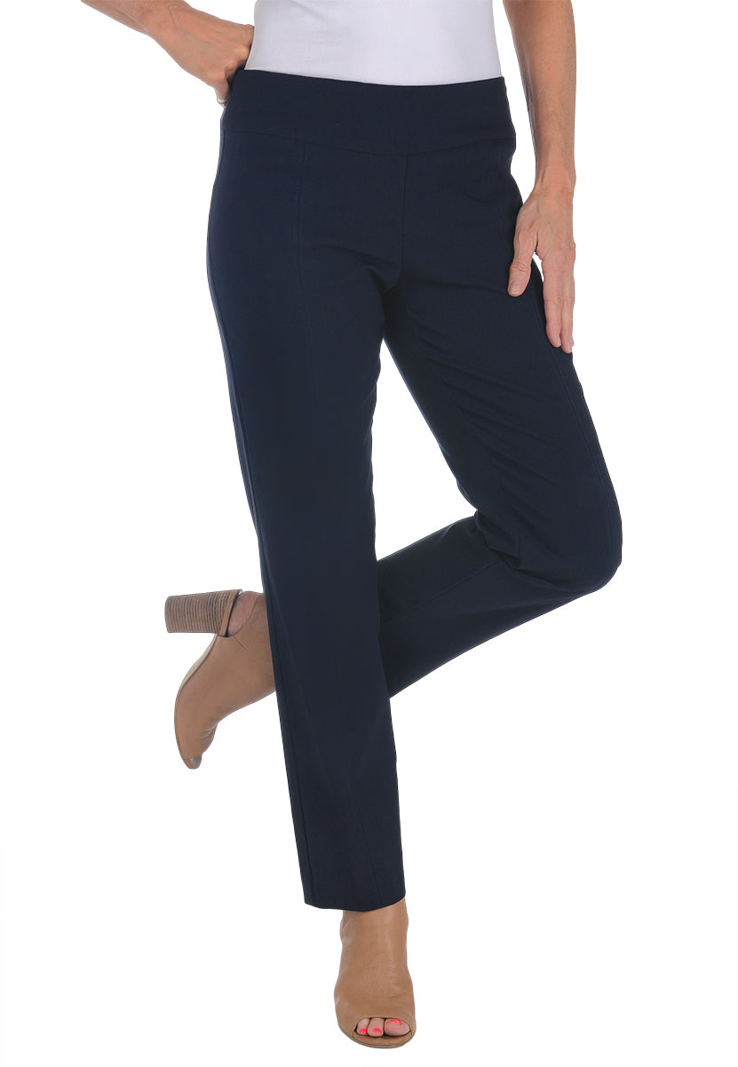 A front shot of a model wearing navy pull-on full-length pants with a mesh panel in the waistband and a front leg seam for a tailored look.