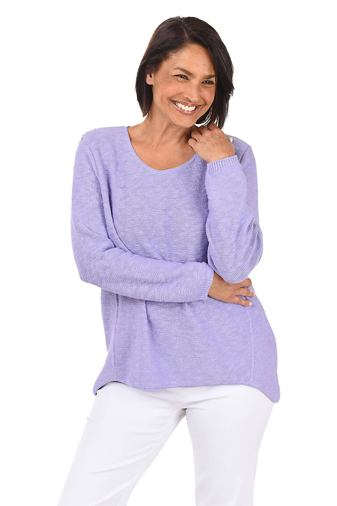 A woman wearing a long sleeve lavender cotton scoop neck sweater, with a seam down the front and white pants.