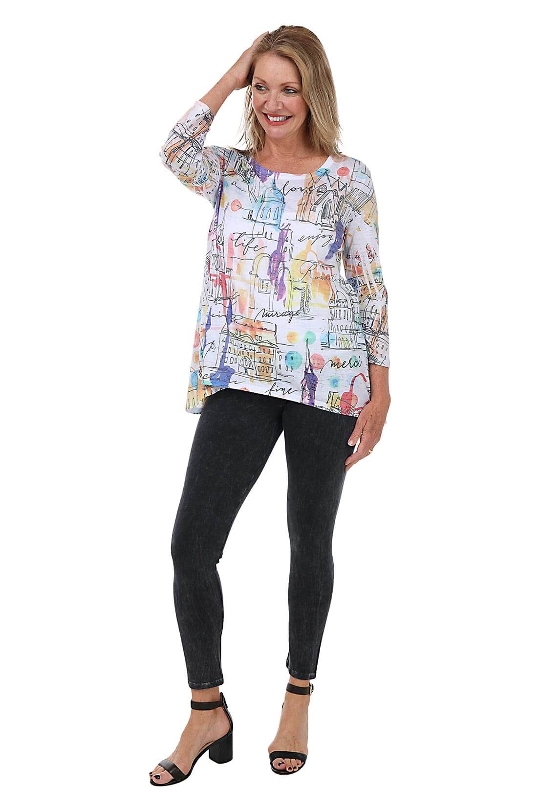 A full length shot of a model wearing a pair of black mineral wash leggings with an elastic waistband, ankle-length design, and front rise positioned at 9 1/2 inches.