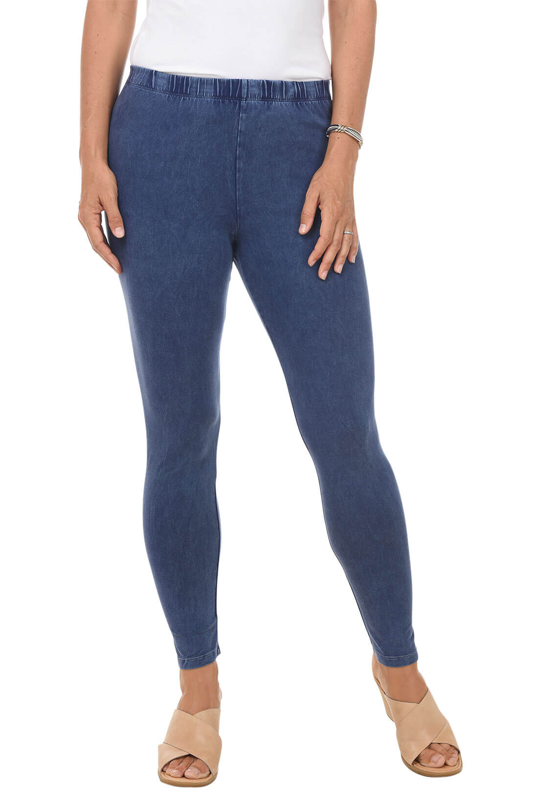 A front shot of a model wearing a pair of denim mineral wash leggings with an elastic waistband, ankle-length design, and front rise positioned at 9 1/2 inches.