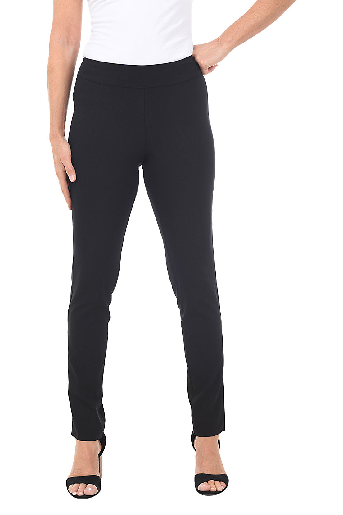 A front shot of a model wearing black pull-on slim full-length pants with a slim leg, paired with a white top and black shoes.