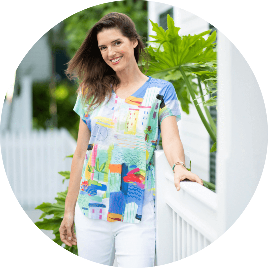 Model posing in front of white fence
