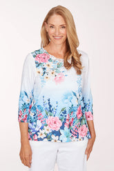 Woman wearing a floral blouse with a white background