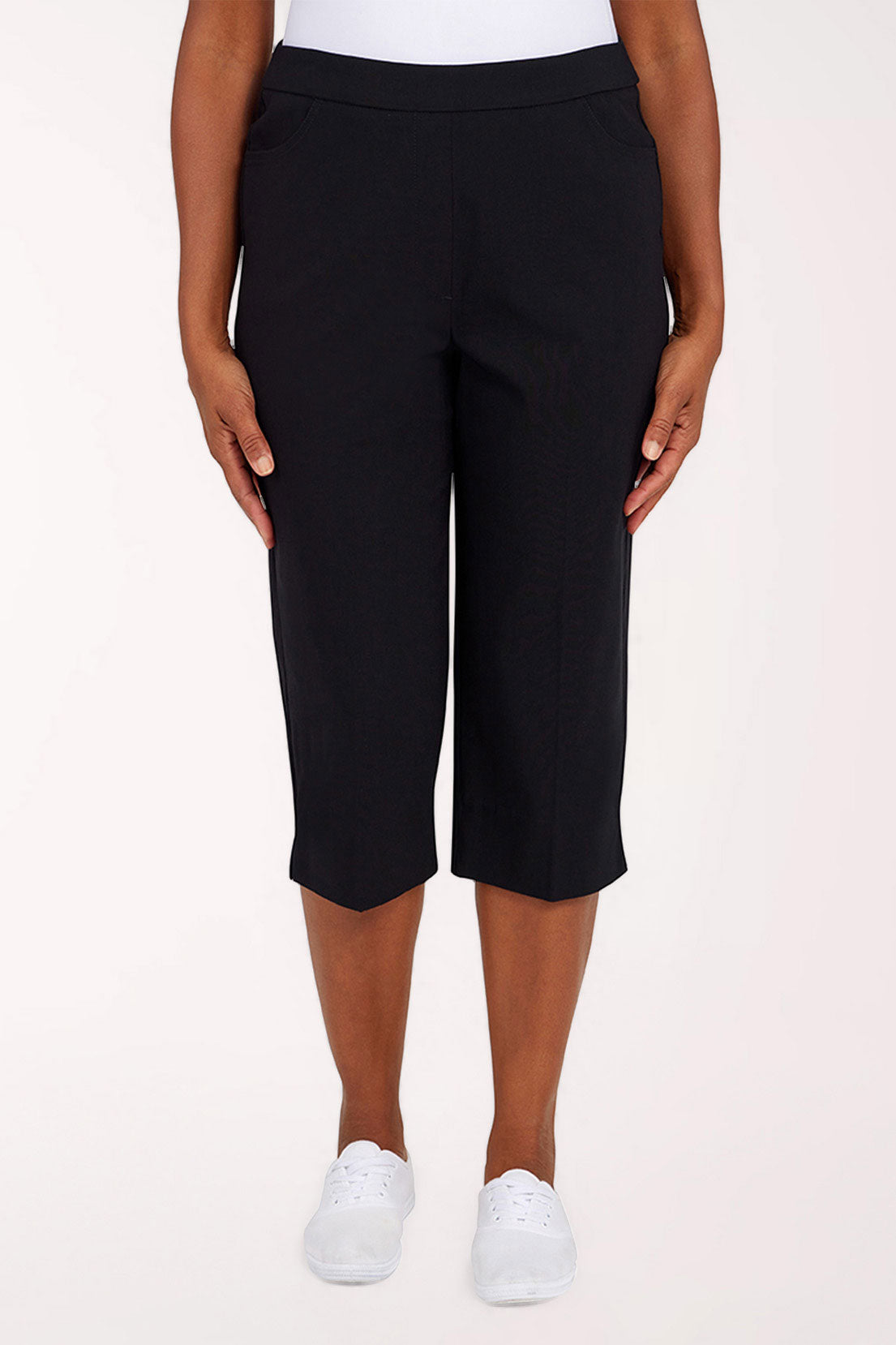 Black  capri pants worn by a person on a white background