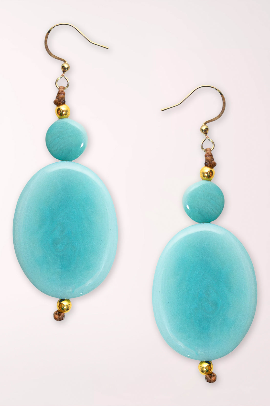 Earrings with light blue colored beads 