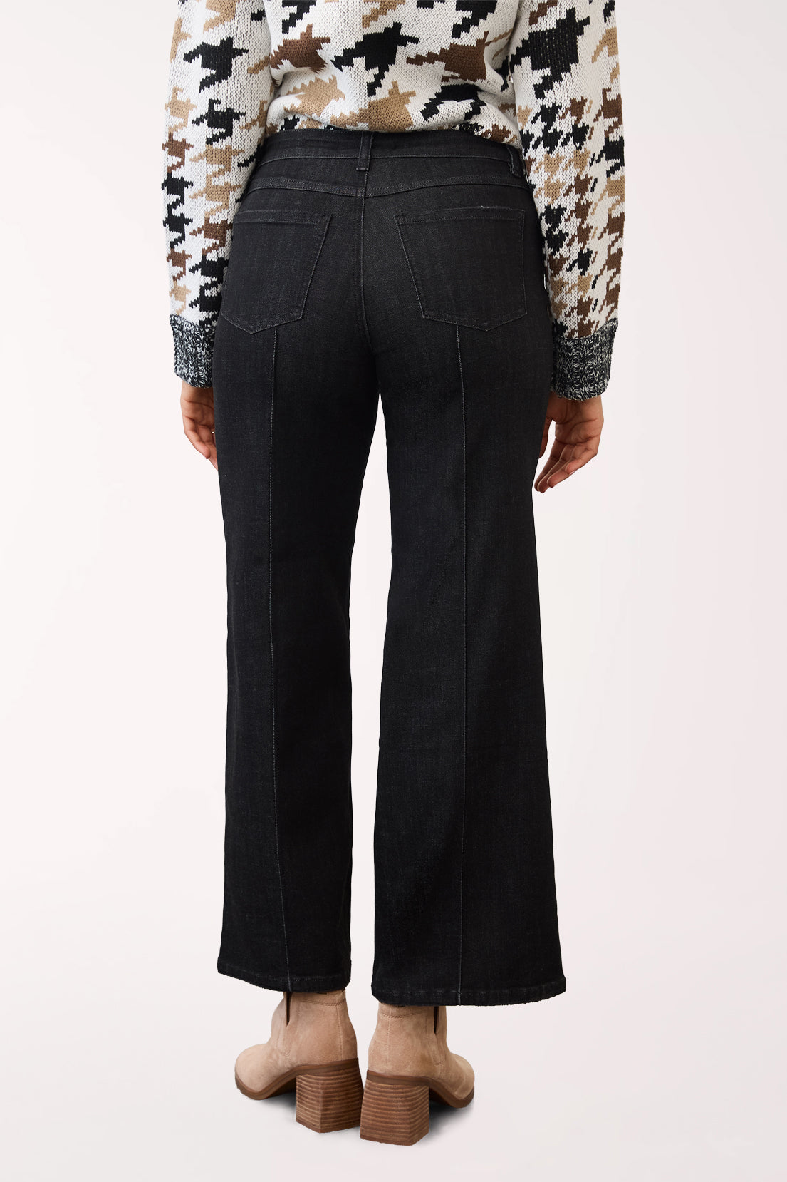 Woman wearing a pintuck wide black denim cropped pant 