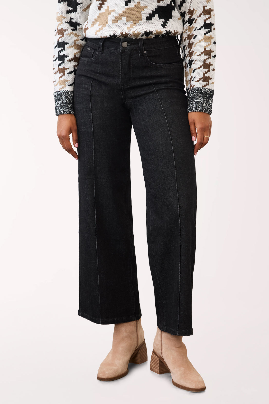 Woman wearing a pintuck wide black denim cropped pant 
