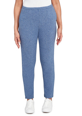 Blue pants worn by a person on a white background