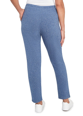 Blue pants worn by a person on a white background