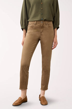 Woman wearing brown ankle pants