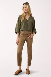 Woman wearing brown ankle pants