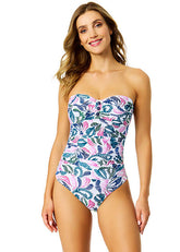 Woman wearing a strapless swimsuit with a floral pattern on a white background