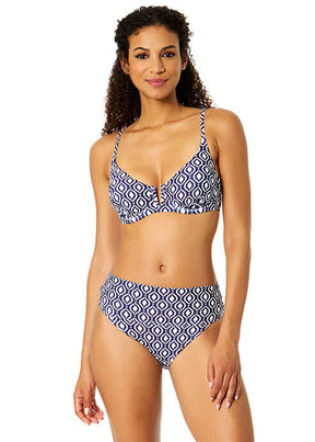 Woman wearing a blue and white patterned bikini on a white background
