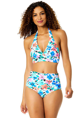 Woman wearing a floral two-piece swimsuit on a white background