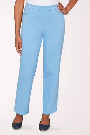 Light blue pants worn by a person on a white background