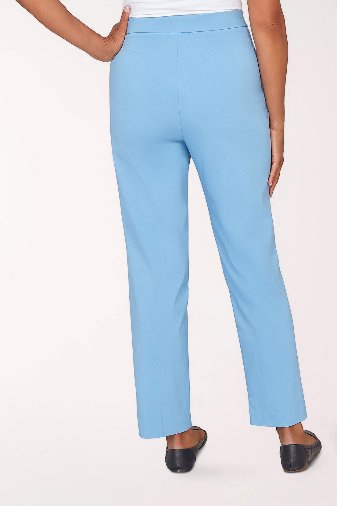 Light blue pants worn by a person on a white background