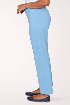 Light blue pants worn by a person on a white background