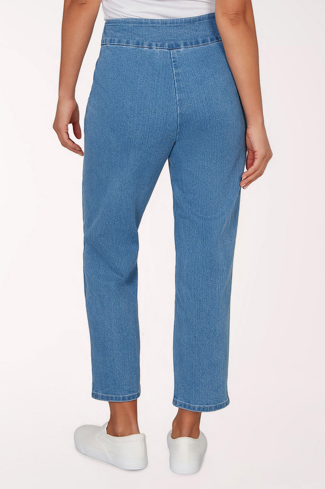 Blue jeans with butterfly embroidery on a white background