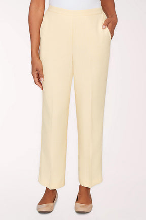 Light yellow pants worn by a person on a white background