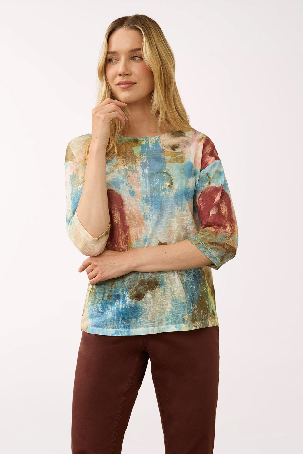 Woman wearing a 3/4 sleeve multicolored top 