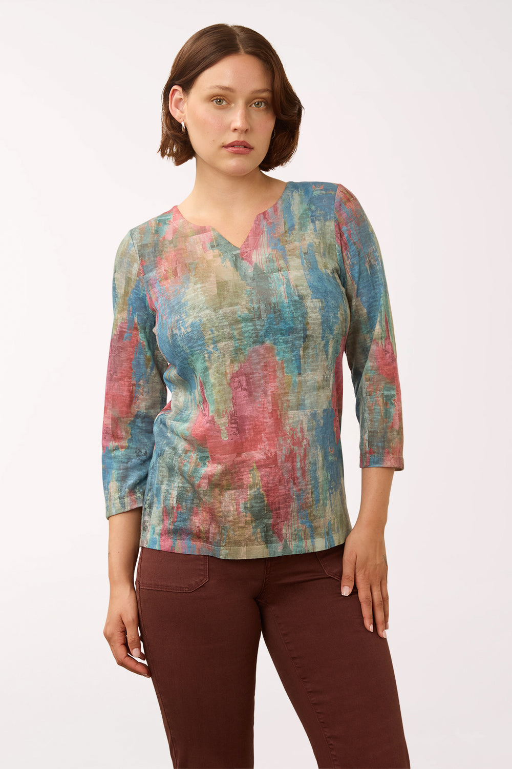Woman wearing a 3/4 sleeve multicolored top 