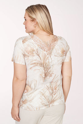 Woman wearing a floral blouse against a white background