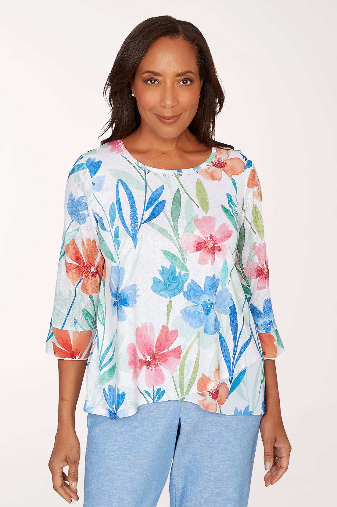 Woman wearing a floral blouse with a white background