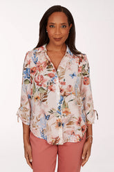Woman wearing a floral button down top