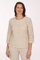 Woman wearing a beige crop top