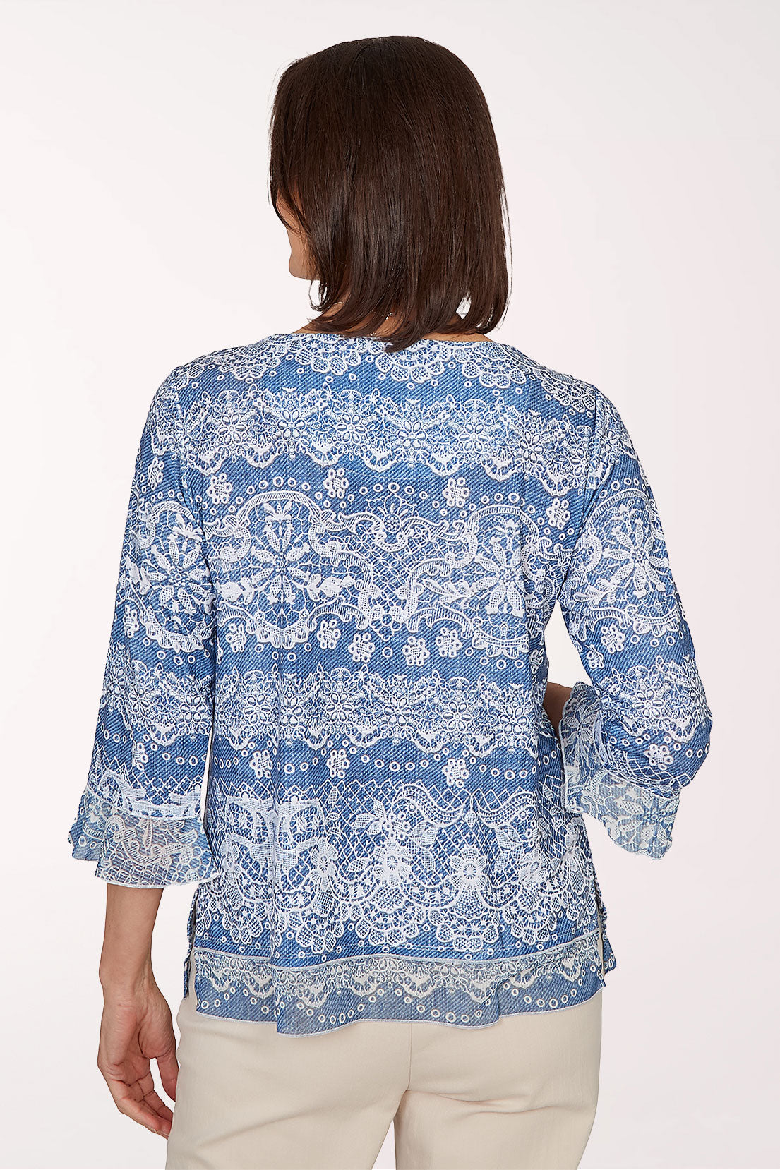 Woman wearing a blue multi 3/4 sleeve top