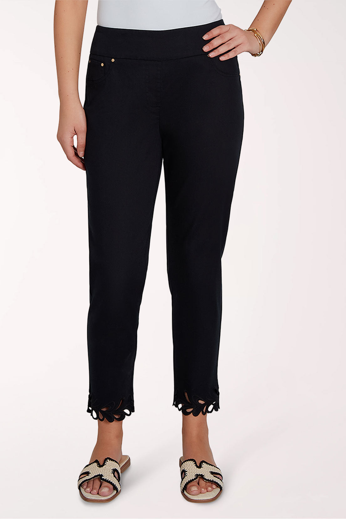 Black pants with scalloped hem on a white background