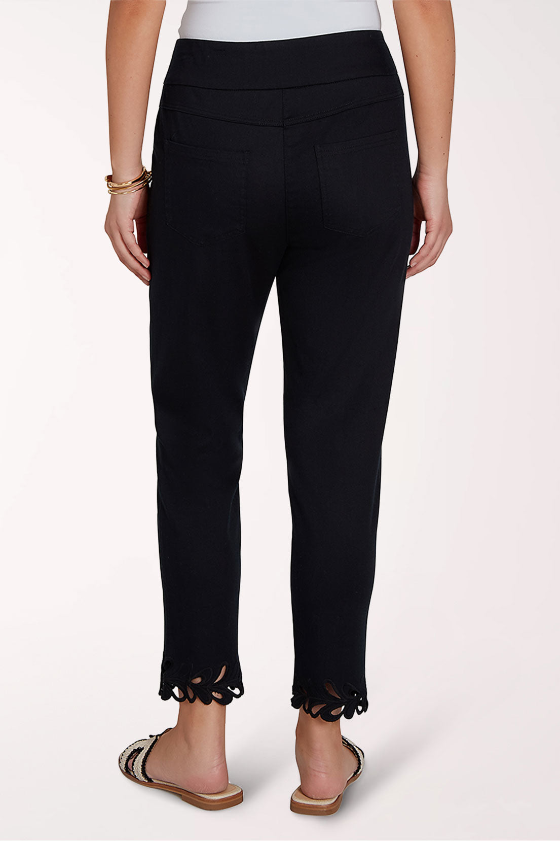 Black pants with scalloped hem on a white background