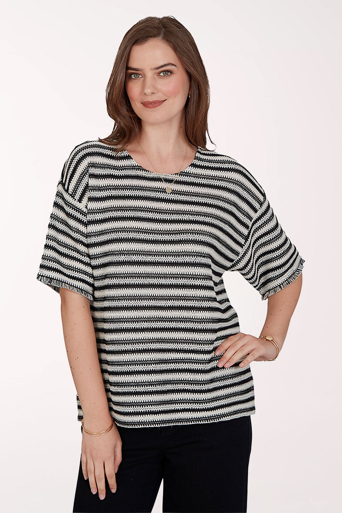 Woman wearing a black and white striped shirt on a white background