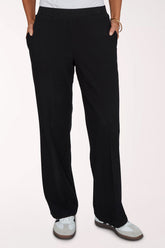 Woman wearing black full-length lounge pants